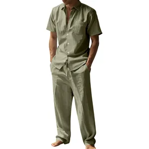 Detail view of a men's olive green linen short-sleeve shirt and matching casual trousers set.