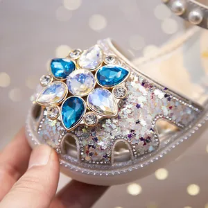 Elegant girls' closed-toe princess sandals featuring blue crystal flowers and glitter