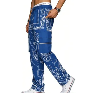 Blue men's cargo pants with white paisley pattern and multiple functional side pockets.