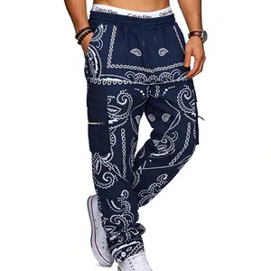 Men's blue bandana print cargo pants in a baggy hip hop style with multi-pocket details.