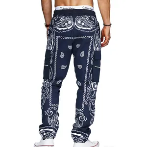Back view of men's navy paisley cargo pants in a loose streetwear hip hop style.