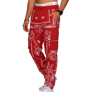 Detailed view of red paisley print cargo pants with streetwear multi-pocket design