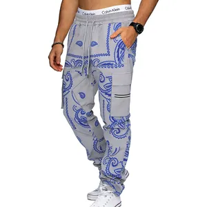 Macro view of grey men's cargo pants featuring blue paisley print and utility pockets