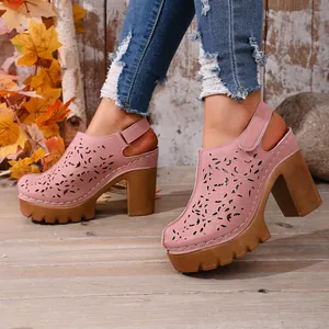 Sabot vintage rosa con tacco largo, plateau e motivi decorativi traforati al laser