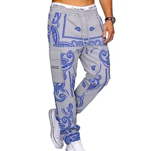Close-up detail of grey paisley cargo pants for men featuring high street hip hop styling