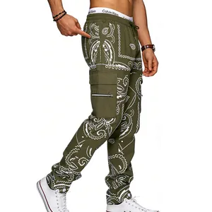 Side view detail of olive green men's cargo pants featuring white paisley print