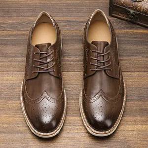 Top-down view of men's brown leather Brogue shoes with vintage carving details.