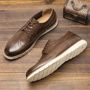 Detail of vintage brown leather brogue shoes for men with thick white non-slip soles