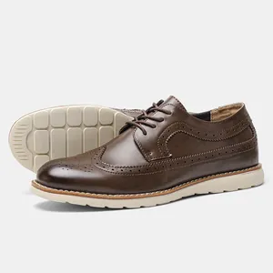 Detailed side and sole view of men's brown leather brogue shoes with light soles