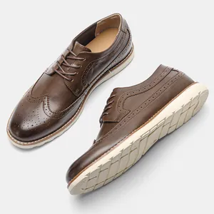 Detailed view of men's brown leather Brogue shoes with wingtip design and white sole
