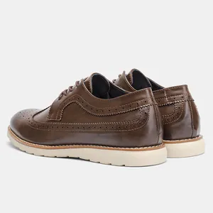Rear view of men's brown leather brogue shoes with lightweight white sole