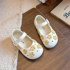 White girl's Mary Jane princess shoes with yellow embroidered flower decorations