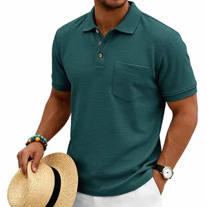 Detail view of men's teal waffle knit polo shirt with textured fabric and chest pocket.