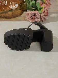 Detailed view of the deep tread sole and sturdy block heel on a black platform sandal.