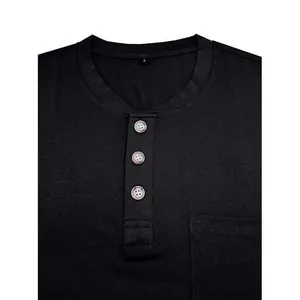 Close-up detail of black men's Henley T-shirt showing buttons and pocket texture.