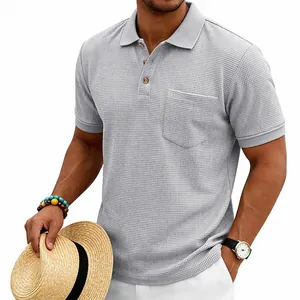Detailed macro view of men's grey waffle knit polo shirt with premium textured fabric