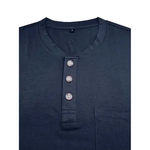 Close-up view of navy blue Henley neckline featuring wooden buttons and chest pocket