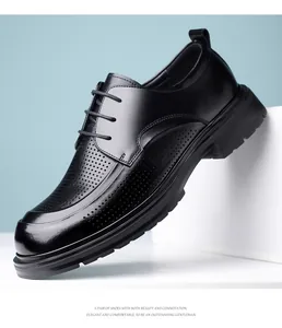 Close-up of black perforated leather dress shoes for men, business casual style.
