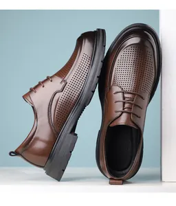 Close-up side and top-down view of brown perforated men's business casual dress shoes.