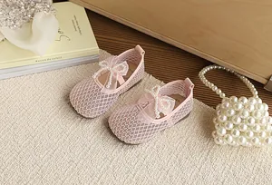 Pink breathable mesh flat princess shoes for girls with elegant pearl bow detail for summer.