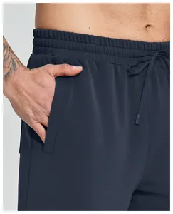 Close-up detail of modal men's sports shorts showing elastic waistband and side pocket.