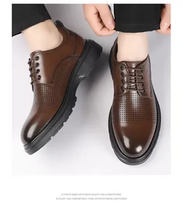 Close-up of brown men's perforated leather dress shoes showing elegant lace-up design