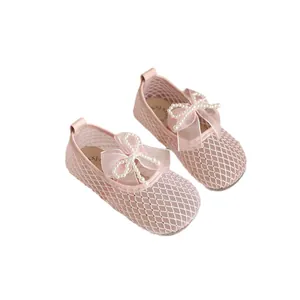 Elegant pink mesh girl's princess shoes with decorative pearl bow and rhinestone details
