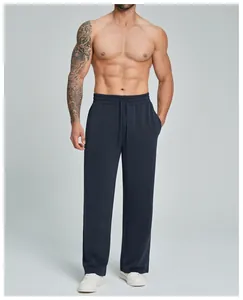 Detail view of breathable navy modal straight-leg lounge pants for men shown on a model