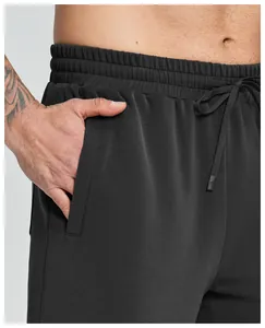 Close-up of men's black modal sports shorts showing drawstring waist and pocket details