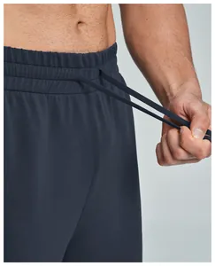 Detail view of men's modal sports trousers with elastic waistband and adjustable drawstring