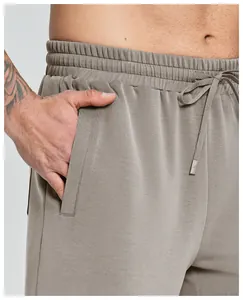 Close-up macro view of grey modal men's shorts showing elastic waistband and side pocket detail