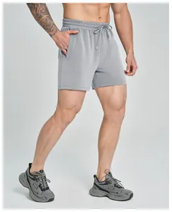 Detailed view of grey breathable modal athletic shorts for men with elastic drawstring waist.