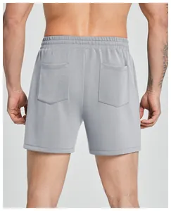 Back view of men's grey modal sports shorts featuring dual pockets and elastic waist