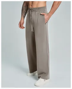 Side detail of men's taupe modal straight-leg casual trousers with a drawstring waist