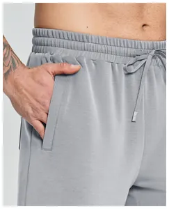 Detail view of men's modal sports shorts featuring elastic waistband and pocket.