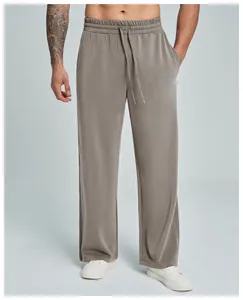 Detail of men's modal straight-leg pants with elastic drawstring waist in grey