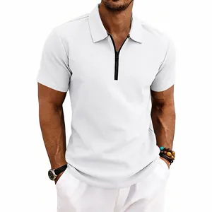 Close-up detail of men's white waffle knit polo shirt featuring a black zipper neck.