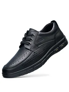 Macro view of men's black perforated leather business casual shoes with lace-up design