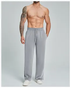 Detailed view of men's breathable modal straight-leg athletic pants on model