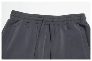 Close-up detail of elastic waistband with adjustable drawstring on modal sports shorts
