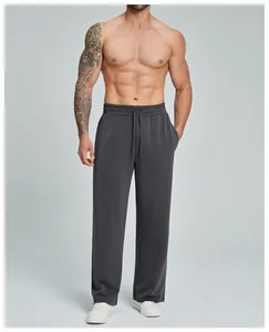 Close-up detail of men's modal straight-leg casual trousers in a dark charcoal grey