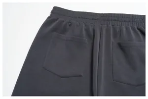 Close-up detail of the back pockets and elastic waistband on men's dark grey modal shorts