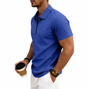 Close-up detail of a men's blue waffle-knit polo shirt with a stylish quarter-zip collar