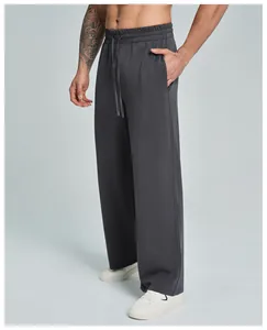 Detail view of men's dark grey Modal straight-leg pants with elastic drawstring waist.