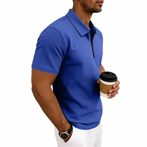 Close-up of men's blue waffle knit polo shirt showing quarter-zip collar and texture detail.