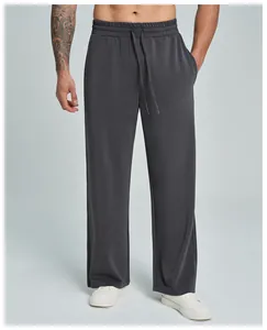 Close-up of men's breathable modal straight-leg sports pants in dark grey finish.