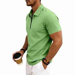 Detailed side view of light green waffle knit men's polo shirt with zip collar