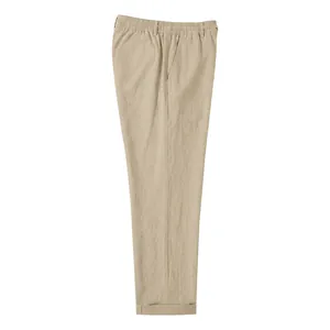Vista detallada de pantalones casuales de lino beige para hombre con cintura elástica