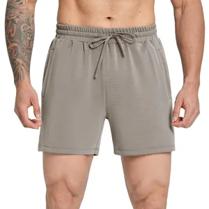 Comfortable men's modal breathable sports shorts in grey, front view on model