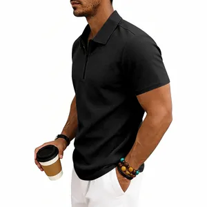 Detail of black waffle knit short sleeve polo shirt for men featuring a quarter zip